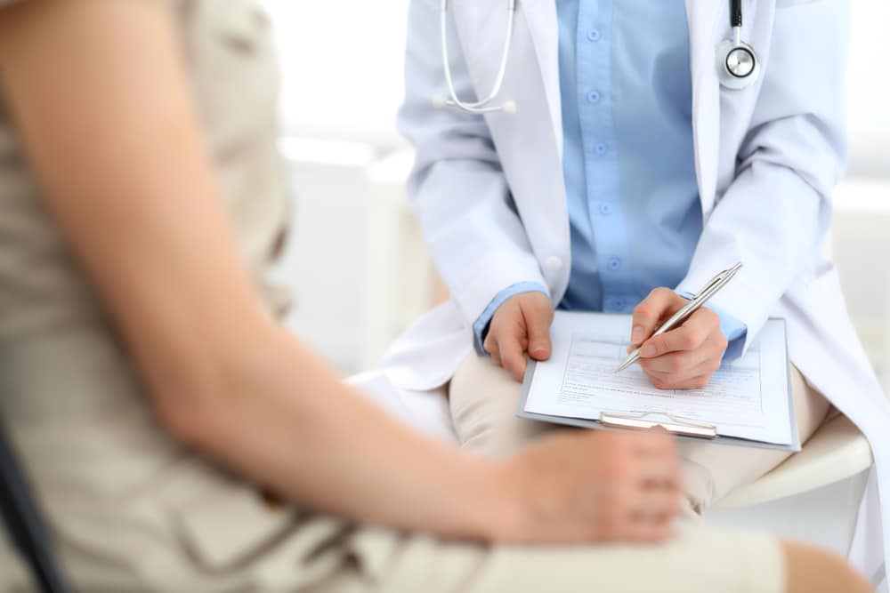 Doctor,And,Patient,Talking.,Physician,At,Work,In,Hospital,While